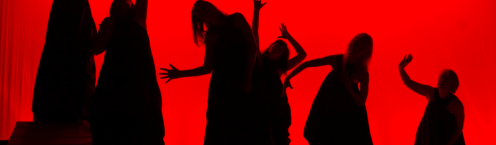 women dancing in silhouette